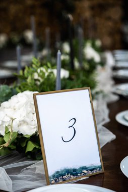 Framed table number at the festive banquet.