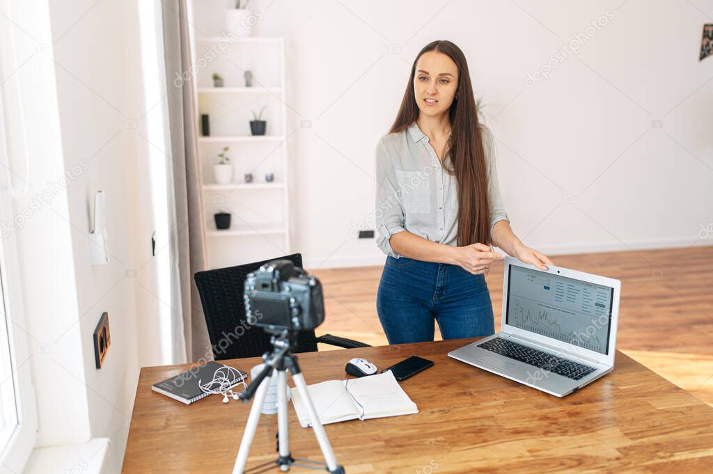 Young woman records video lessons on camera