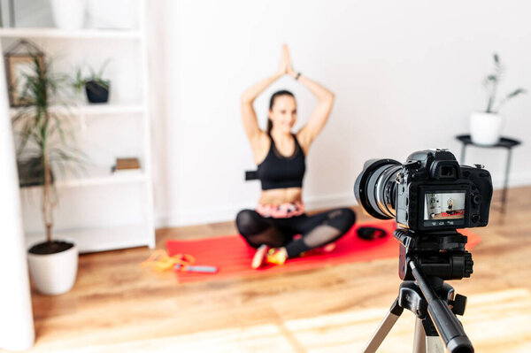 A woman is training and recording tutorial video