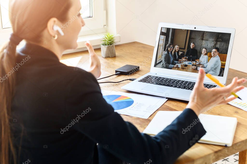 A woman talks via video connection with employers