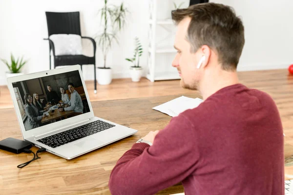 A young guy uses laptop for video call — Stock Photo, Image