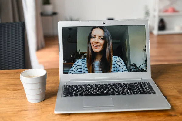 Video meeting on laptop screen, zoom app