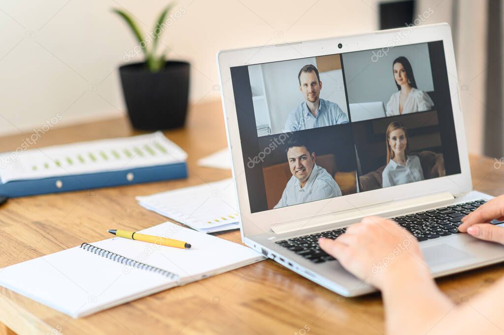 Woman is using app on laptop for video connect