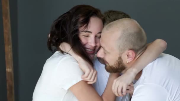 Happy family moments, boy hugs his young parents closeup in studio on photoshoot — Stockvideo