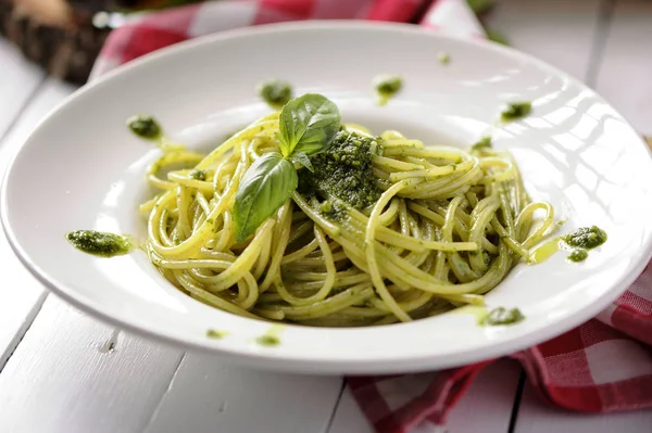 Delicious italian pasta with ligurian pesto and pine nuts — Stock Photo, Image