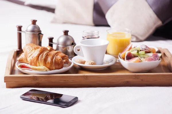 breakfast tray in an hotel room