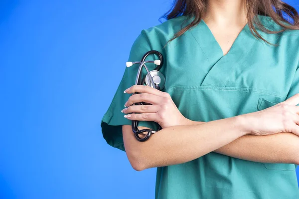 Lekarz medyczny tło zielony stetoskopem — Zdjęcie stockowe