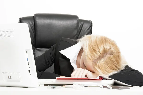 Unhappy woman sitting in her office — Stock Photo, Image