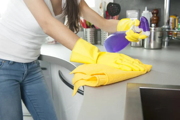 Woman cleaning modern kitchen — Stock Photo, Image
