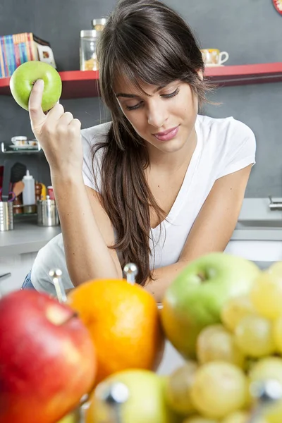 Young woman in a modern kitchen — Stock Photo, Image