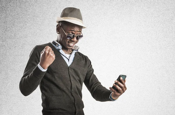 Young African American man using smart phone