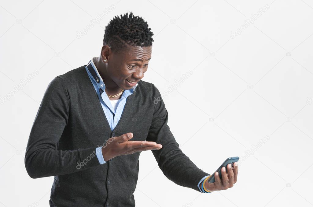 Young African American man using smart phone