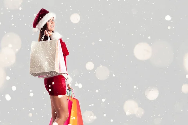 Santa mujer con bolsas de compras — Foto de Stock