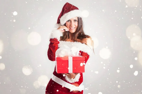 Weihnachtsmann Frau mit Geschenk — Stockfoto