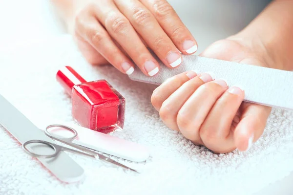 Hand woman polishing her nails