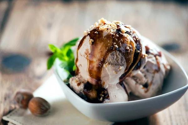 Fresh hazelnut ice cream on plate close up — Stock Photo, Image