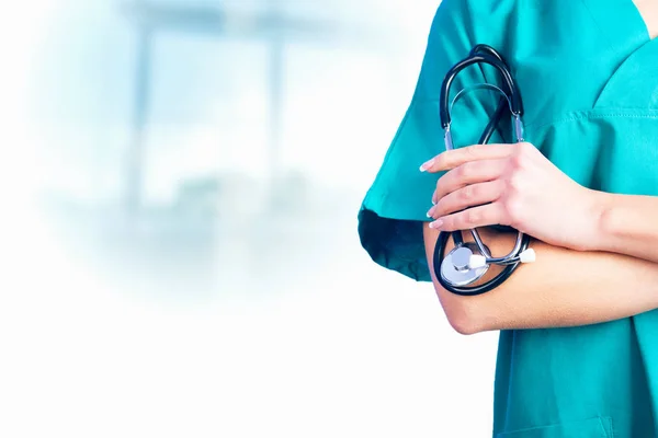 Female Doctor holding a stetoschope in her hands — Stock Photo, Image