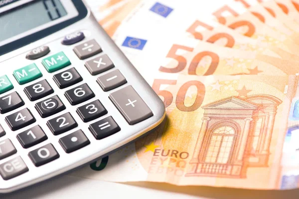 Calculator and euro money on a table desk — Stock Photo, Image