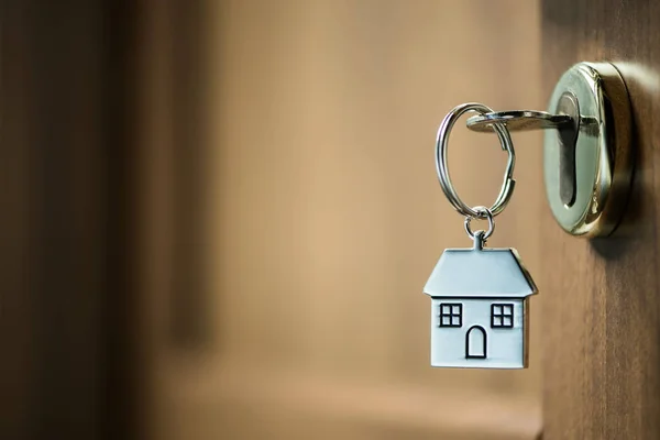 House key in a door — Stock Photo, Image