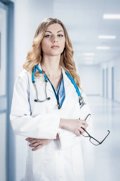 Female Doctor White Surgical Coat Stethoscope Blue Paper Holder Hands — Stock Photo, Image