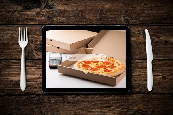 A tablet to order food delivery at home with pizza home delivery