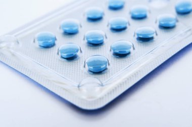 Blue pills in blister close-up