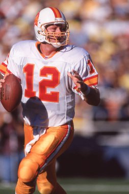 Tampa Bay Buccaneers quarterback Trent Dilfer in NFL action during the 1990s. clipart