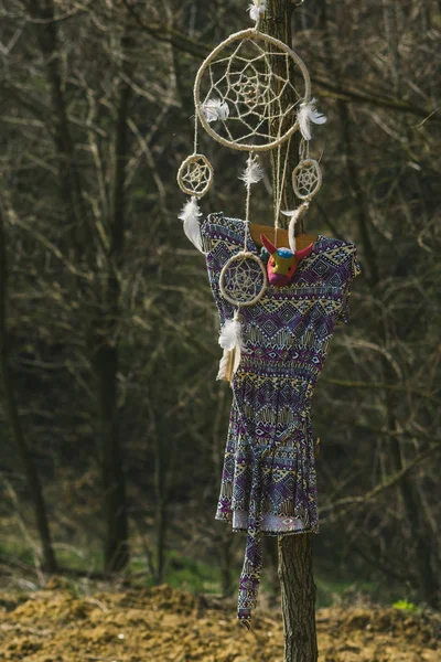 On the tree hanging dream catcher and a woman's dress. Hipster s — Stock Photo, Image