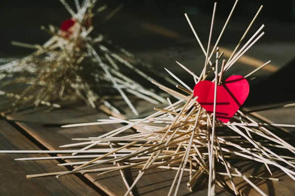The paper heart lies on the wooden sticks. idea — Stock Photo, Image