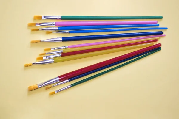Bright Multicolored Brushes Yellow Background — Stock Photo, Image