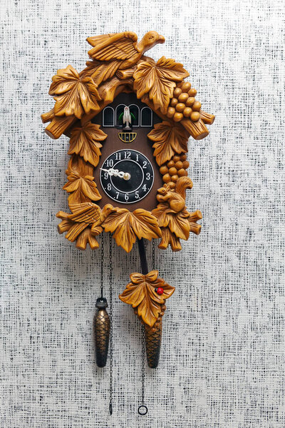 old fashioned wall clock with pendulum