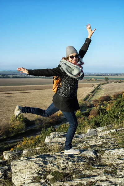 Young joyful woman posing in autumn outfit, natural outdoors Royalty Free Stock Images