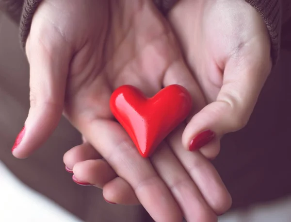 Red heart in woman hands, symbol of love — Stock Photo, Image