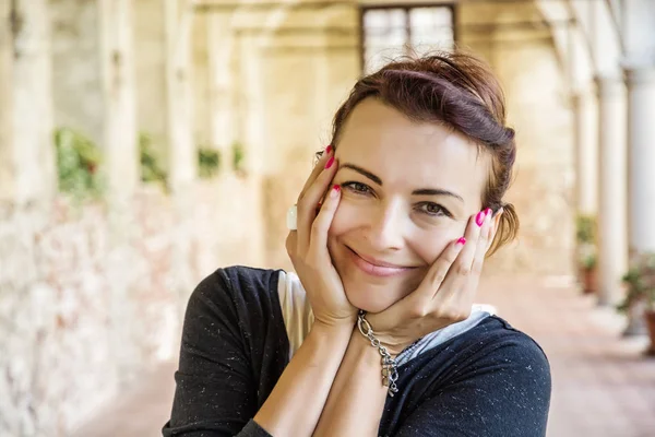 Joyful woman in medieval corridor, Telc, Czech republic — Stock Photo, Image