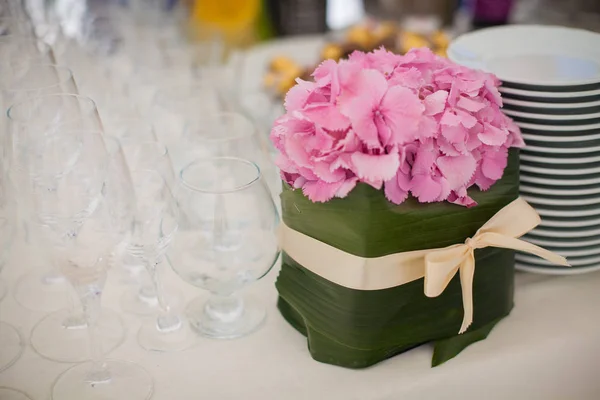 Elegant flower decoration on the table in restaurant for an even