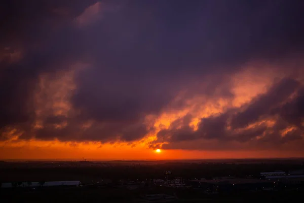 Epic Sunset. Sky Foggy Clouds. Apocalypse. The sky before a thunderstorm. horizon. Gloomy clouds. End of the world. threat. Epic dramatic sunset