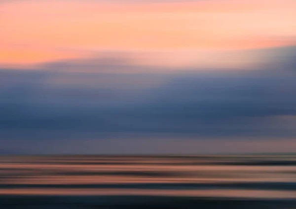 Abstract motion blur sunset nature background on the sea — Stock Photo, Image