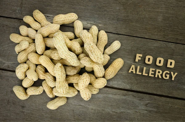 Peanut or groundnut food allergy health concept, close up on woo