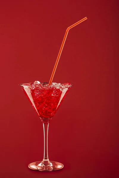 Red cocktail on red background — Stock Photo, Image