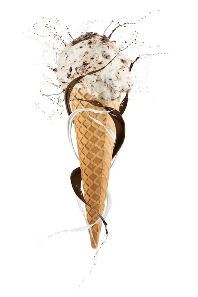 Stracciatella ice cream cone with splashing milk around, isolated on white background