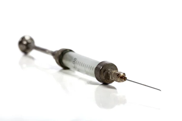 Single Old Syringe Stock Photo