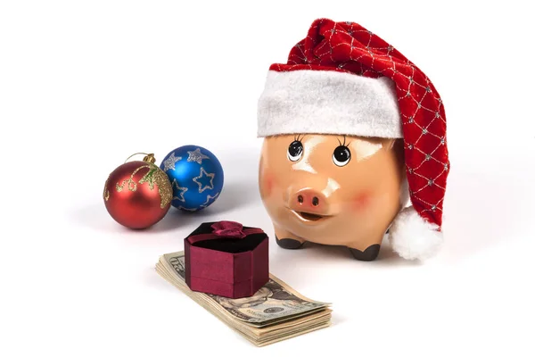 ドルとクリスマスのギフトボックスと装飾のピギーバンク ストック写真