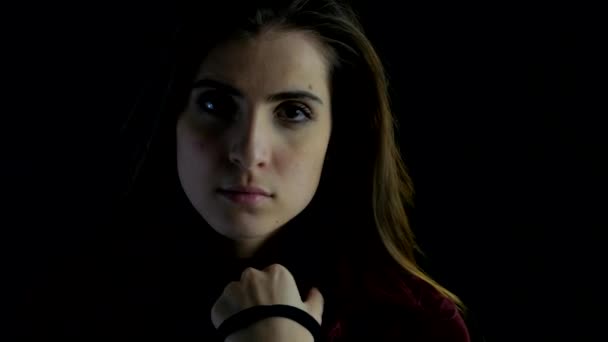 Beautiful female model with black background looking camera — Videoclip de stoc