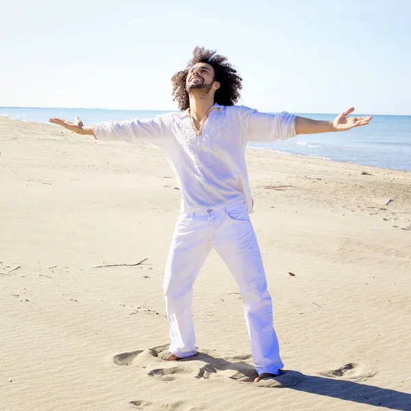 Cool man showing happiness on the beach concept of freedom — Stock Photo, Image