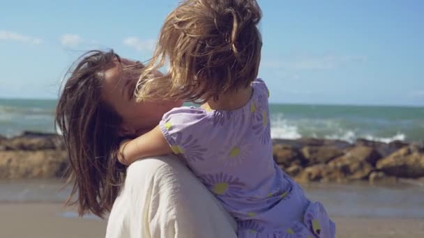 Beautiful Woman Holding Arms Little Blond Daughter Smiling Front Ocean — Stock Video