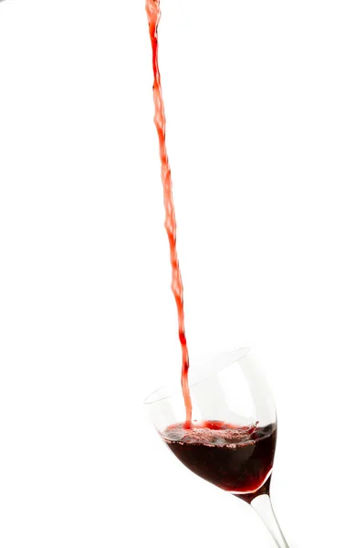 Pouring red wine into a glass — Stock Photo, Image