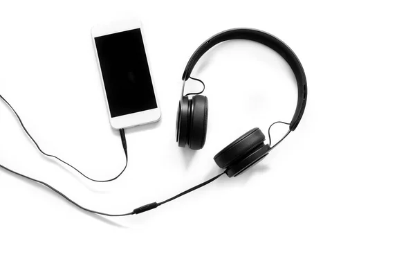 Headset and a phone on white background — Stock Photo, Image