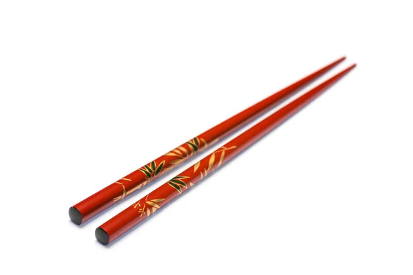 Chopsticks em fundo branco com foco seletivo — Fotografia de Stock