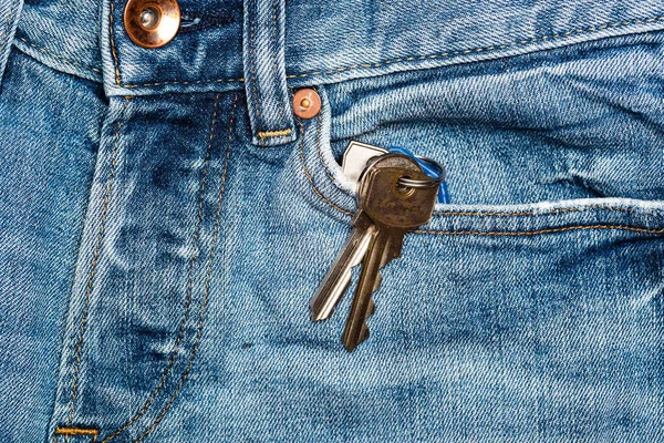Keys hanging out of front pocket on jeans — Stock Photo, Image