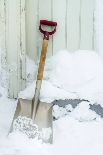 Shovel outside in the snow